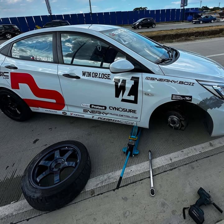 Super Sprint car during a wheel change