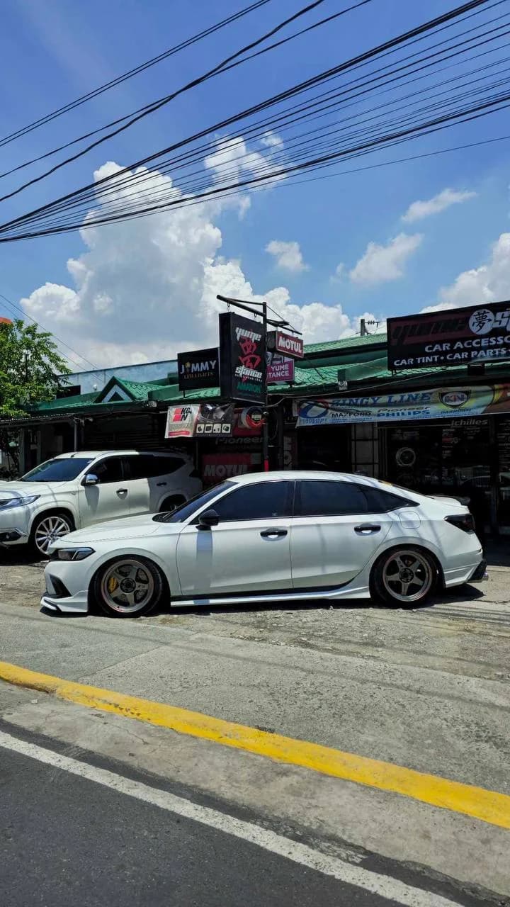 White Honda Civic FE sample installation with extended wheel studs