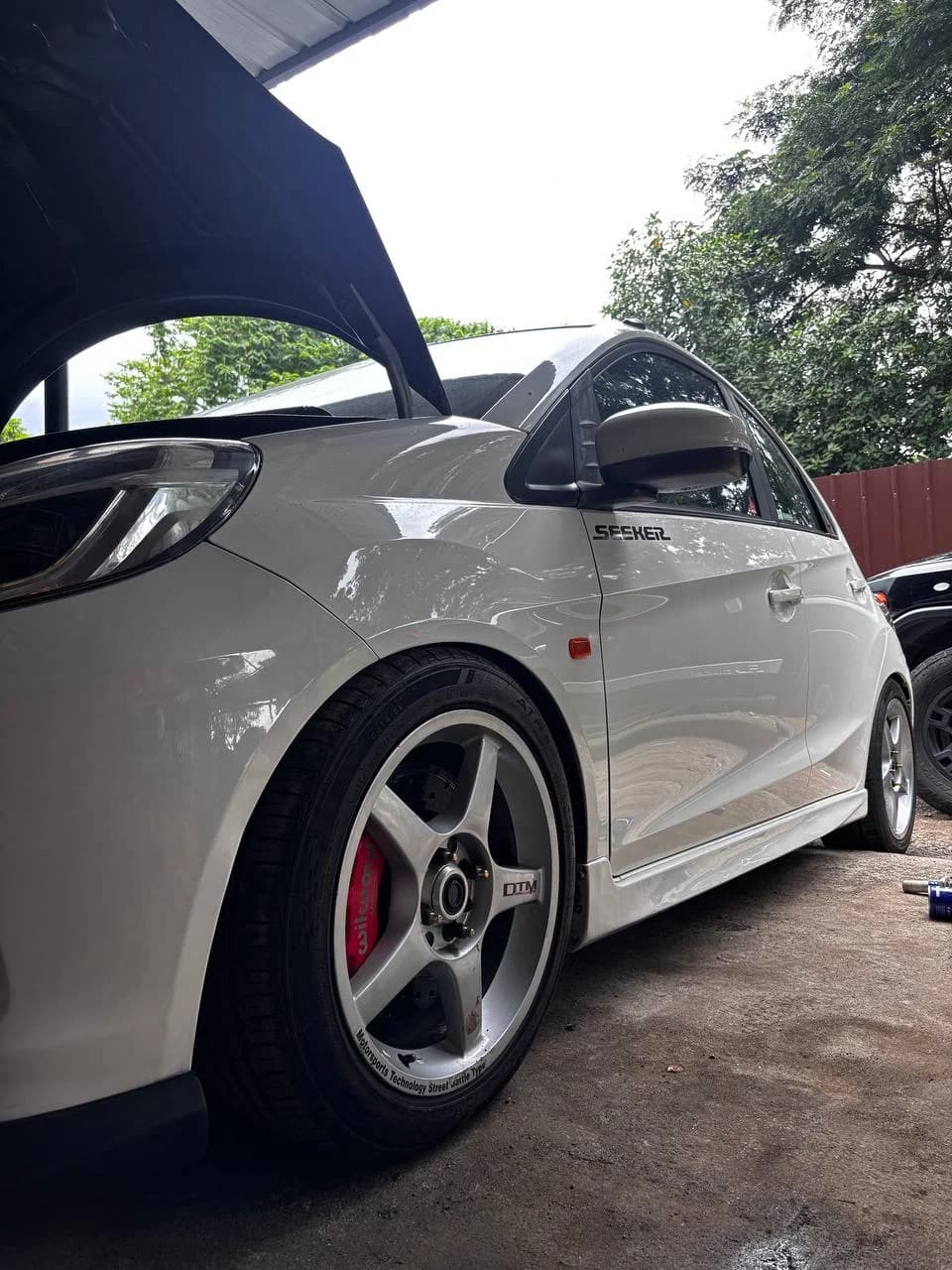 White Honda Brio sample installation with extended wheel studs